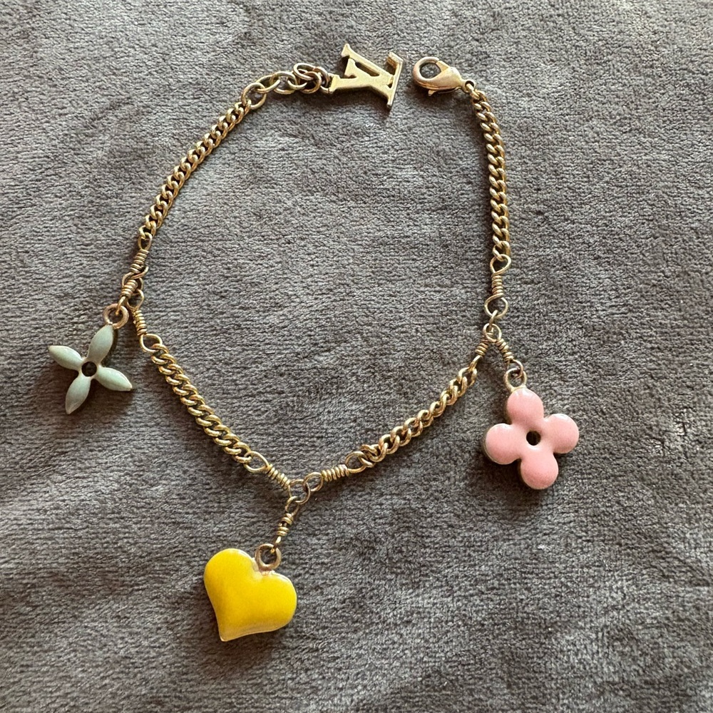 Louis Vuitton Gold tone Bracelet with Charms